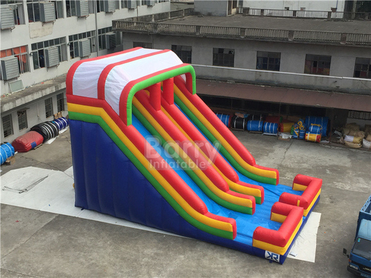 Toboganes acuáticos inflables del carril doble del arco iris de la lona del PVC para el patio de los niños