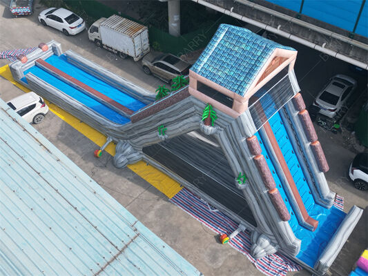 Deslizamiento de agua gigante inflable de grado comercial, doble carril de temática tropical deslizamiento húmedo / seco para parques de diversiones y festivales